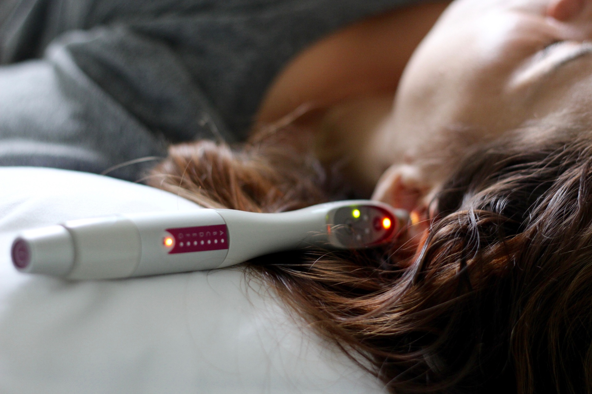 Laser acupuncture pen applied near the ear